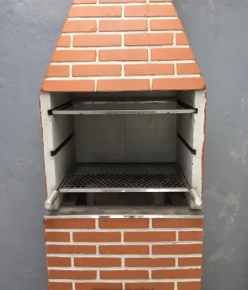Barbacoa de obra en jardín: diseños, materiales y precios León 2026